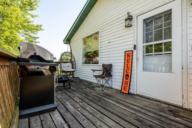 wooden terrace featuring grilling area