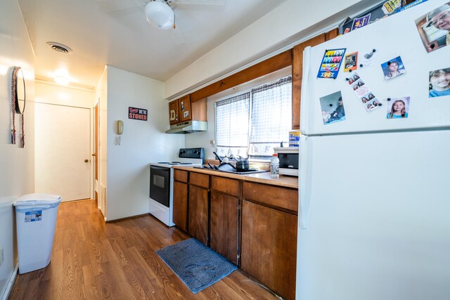 kitchen with white appliances, ceiling fan, and hardwood / wood-style floors