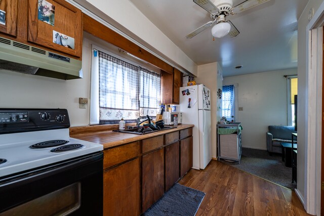 kitchen with ventilation hood, sink, dark hardwood / wood-style flooring, white appliances, and ceiling fan