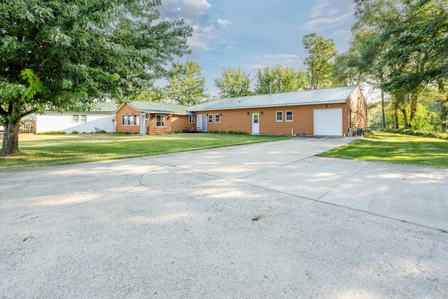 ranch-style house with a front lawn and a garage