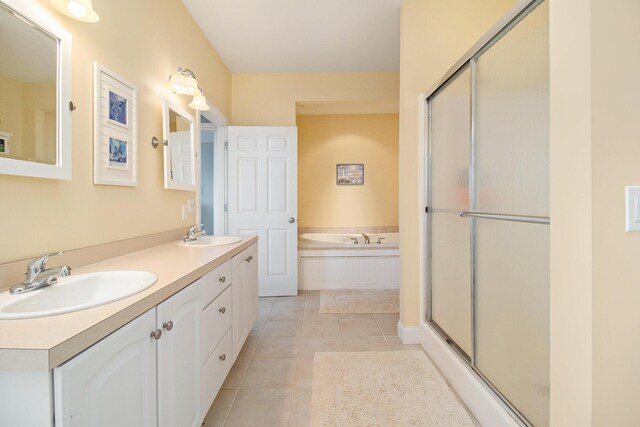 bathroom featuring vanity, tile patterned floors, and shower with separate bathtub