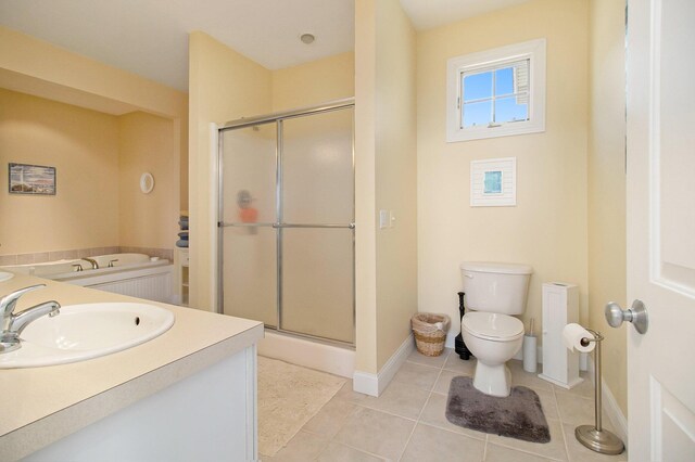 full bathroom with vanity, toilet, independent shower and bath, and tile patterned floors