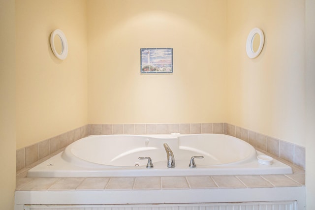 bathroom featuring a relaxing tiled tub