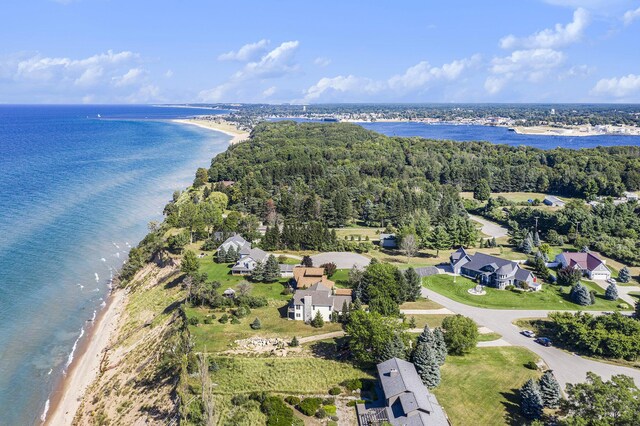 birds eye view of property featuring a beach view and a water view