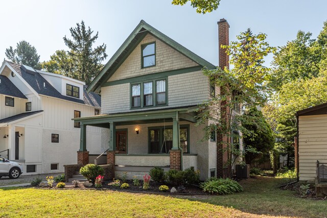 view of front of home featuring a front yard and a porch