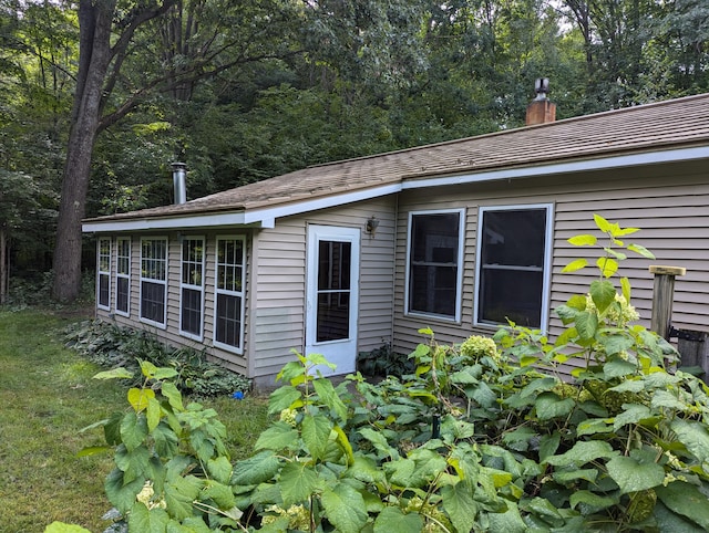 view of property exterior with a chimney