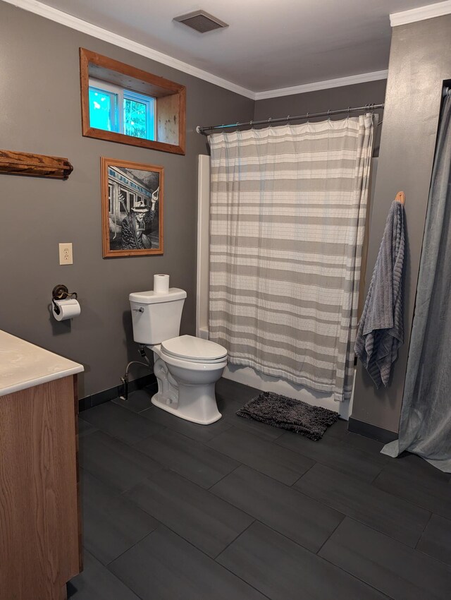 bathroom featuring ornamental molding, vanity, toilet, and hardwood / wood-style floors