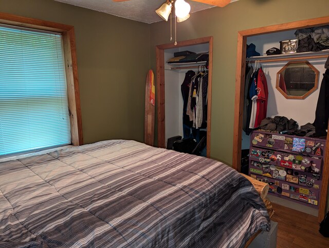 bedroom with a closet, ceiling fan, wood-type flooring, and a textured ceiling