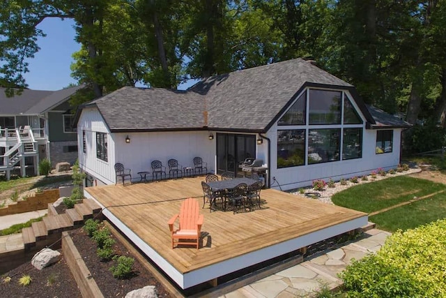 back of property featuring a wooden deck