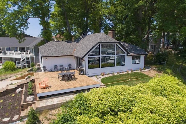 rear view of house with a deck