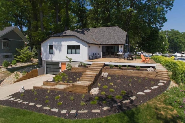 back of house with a garage