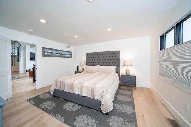 bedroom featuring light hardwood / wood-style floors