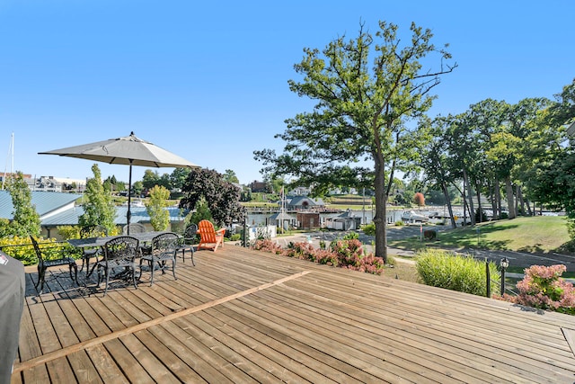 wooden deck with a water view