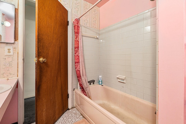 bathroom with shower / bath combo, tile patterned flooring, and vanity