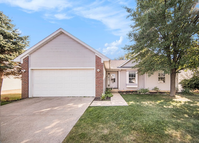 view of front of house featuring a front lawn and a garage