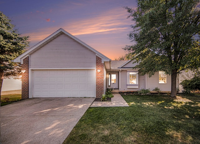 ranch-style home with a lawn and a garage