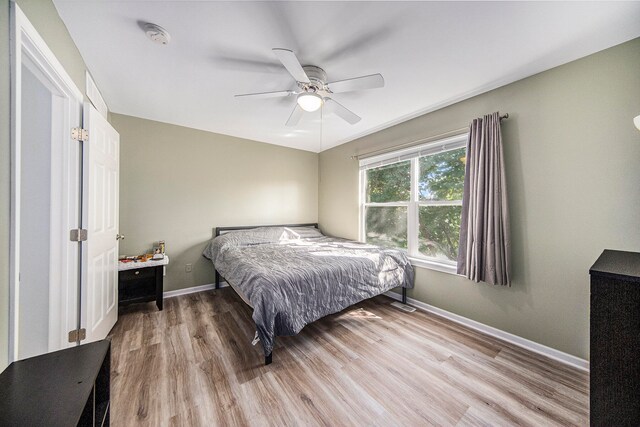 bedroom featuring ceiling fan and light hardwood / wood-style flooring