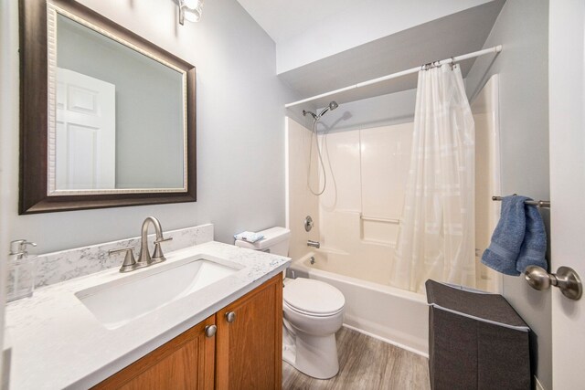 full bathroom featuring shower / tub combo, vanity, toilet, and hardwood / wood-style flooring