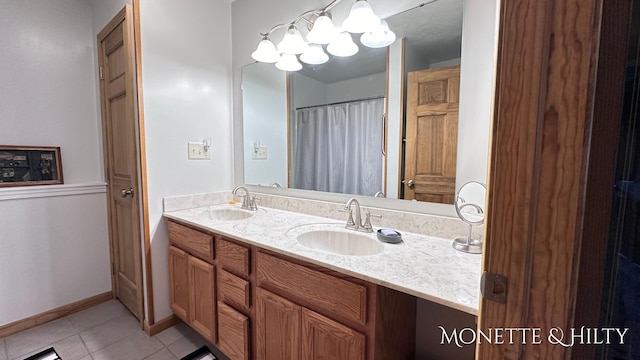 bathroom with vanity and tile patterned flooring