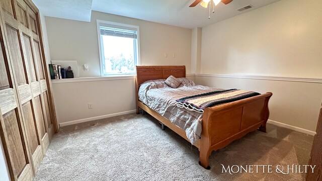 carpeted bedroom featuring ceiling fan