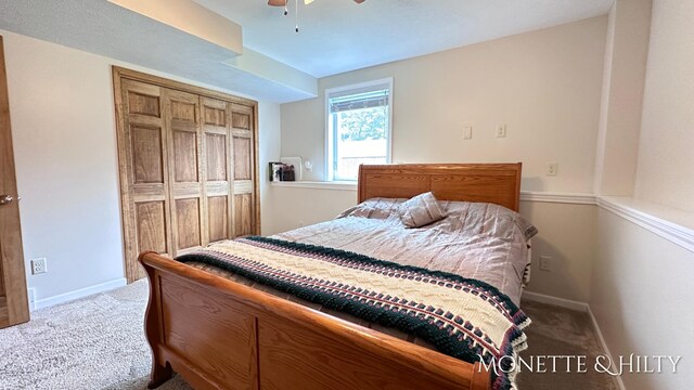 bedroom with carpet, ceiling fan, and a closet