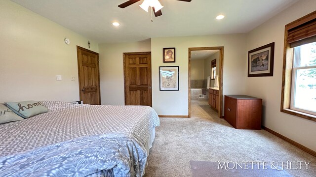 carpeted bedroom with connected bathroom and ceiling fan