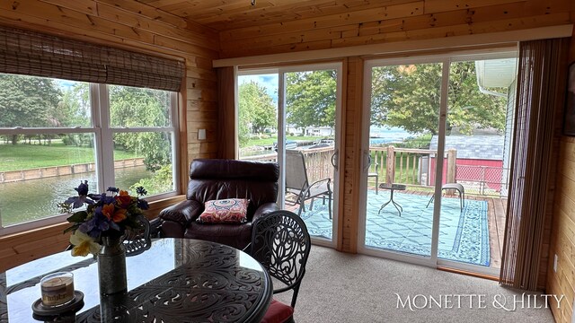 sunroom featuring wooden ceiling