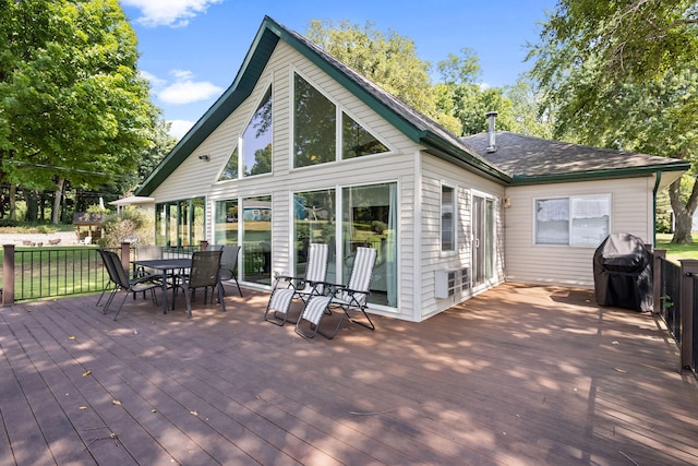 wooden terrace with a grill