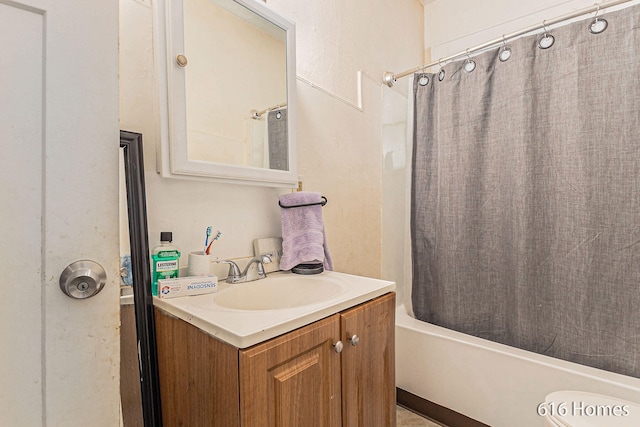 bathroom with vanity and shower / tub combo with curtain