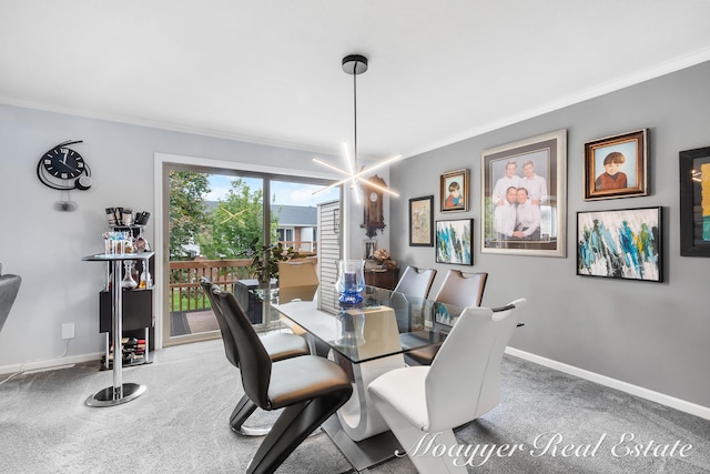 dining space with carpet flooring, a chandelier, and ornamental molding