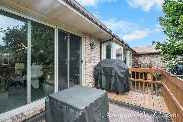 wooden deck featuring grilling area