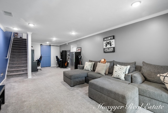 living room with a barn door, carpet, and ornamental molding