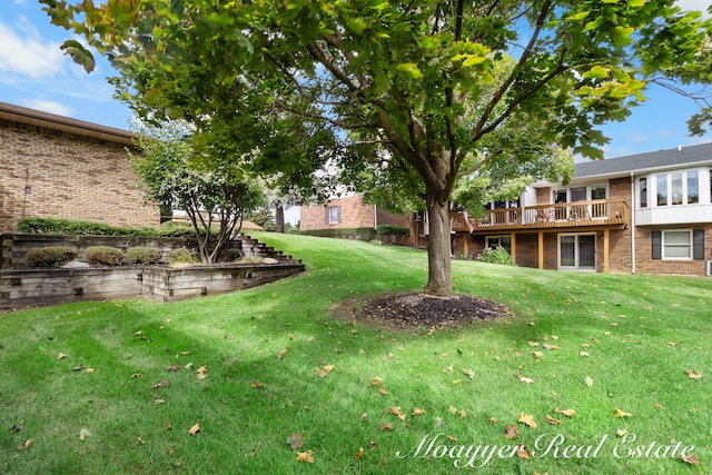 view of yard featuring a wooden deck