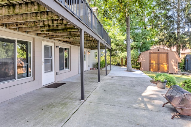 view of patio / terrace with a shed