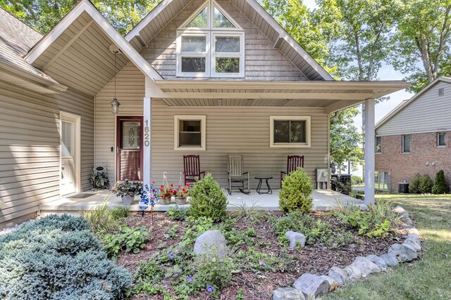 rear view of house with a porch