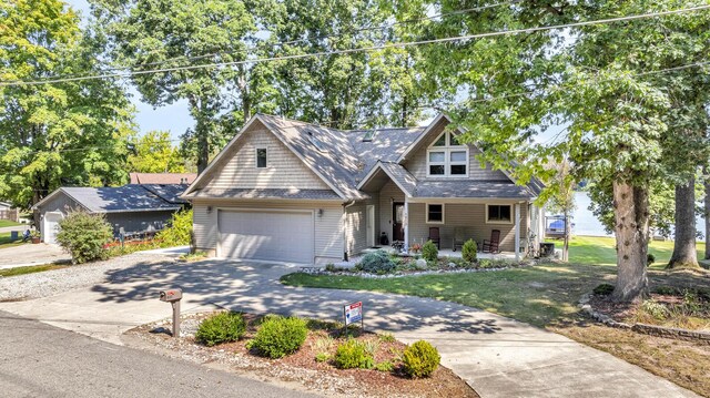 view of front of house with a front yard and a garage