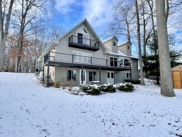 snow covered house with a balcony