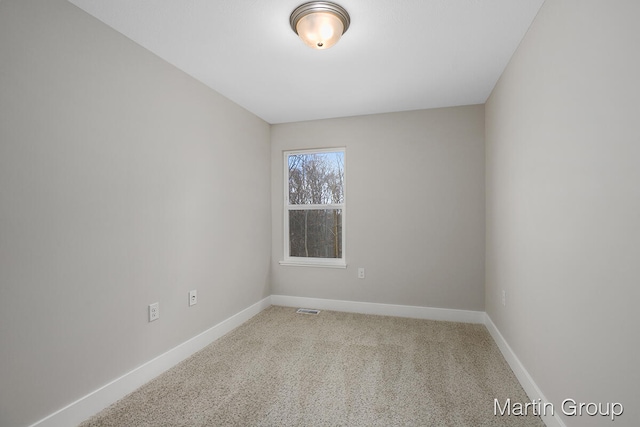 empty room featuring carpet flooring