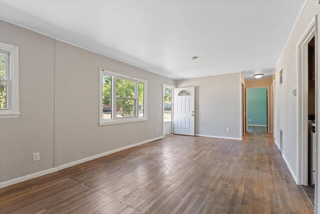 unfurnished room with dark hardwood / wood-style floors