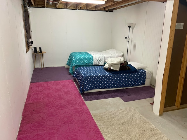 bedroom featuring concrete floors