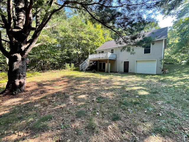 view of yard featuring a garage and a deck