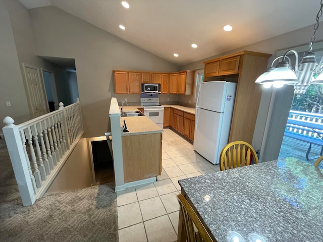 kitchen featuring lofted ceiling, a center island with sink, light tile patterned floors, white appliances, and decorative light fixtures