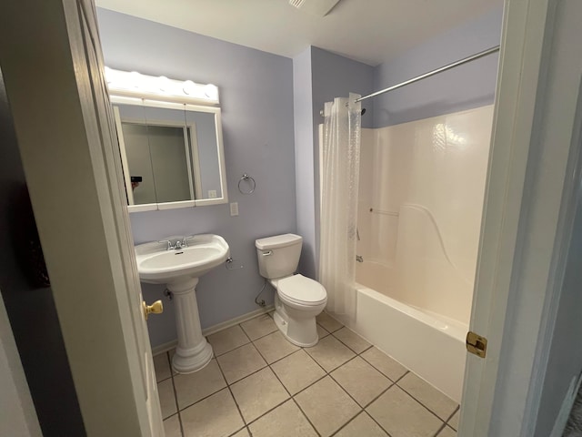 bathroom featuring tile patterned floors, toilet, and shower / bath combination with curtain