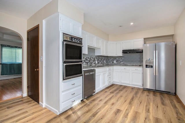 kitchen with white cabinetry, light hardwood / wood-style flooring, stainless steel appliances, and sink