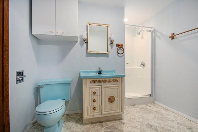 bathroom with toilet, an enclosed shower, and vanity