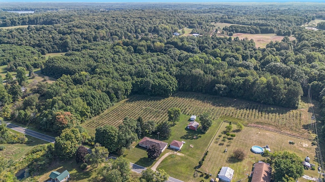 birds eye view of property with a rural view