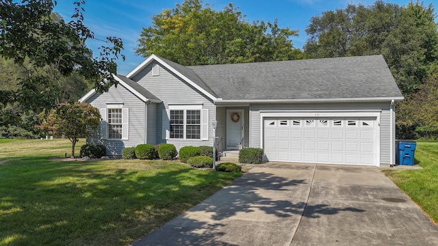 single story home featuring a garage and a front yard