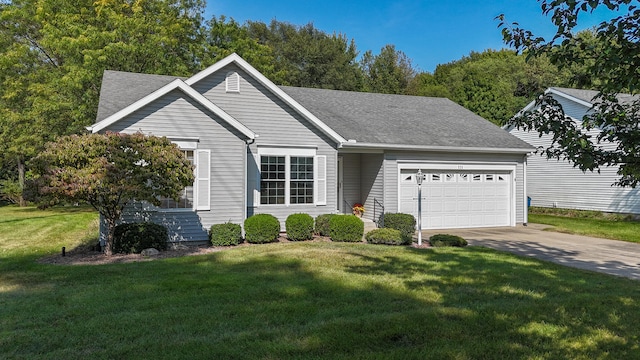 ranch-style house featuring a garage and a front yard