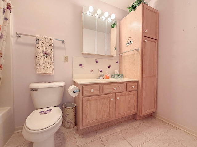 bathroom featuring tile patterned floors, vanity, toilet, and backsplash