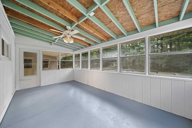 unfurnished sunroom with ceiling fan